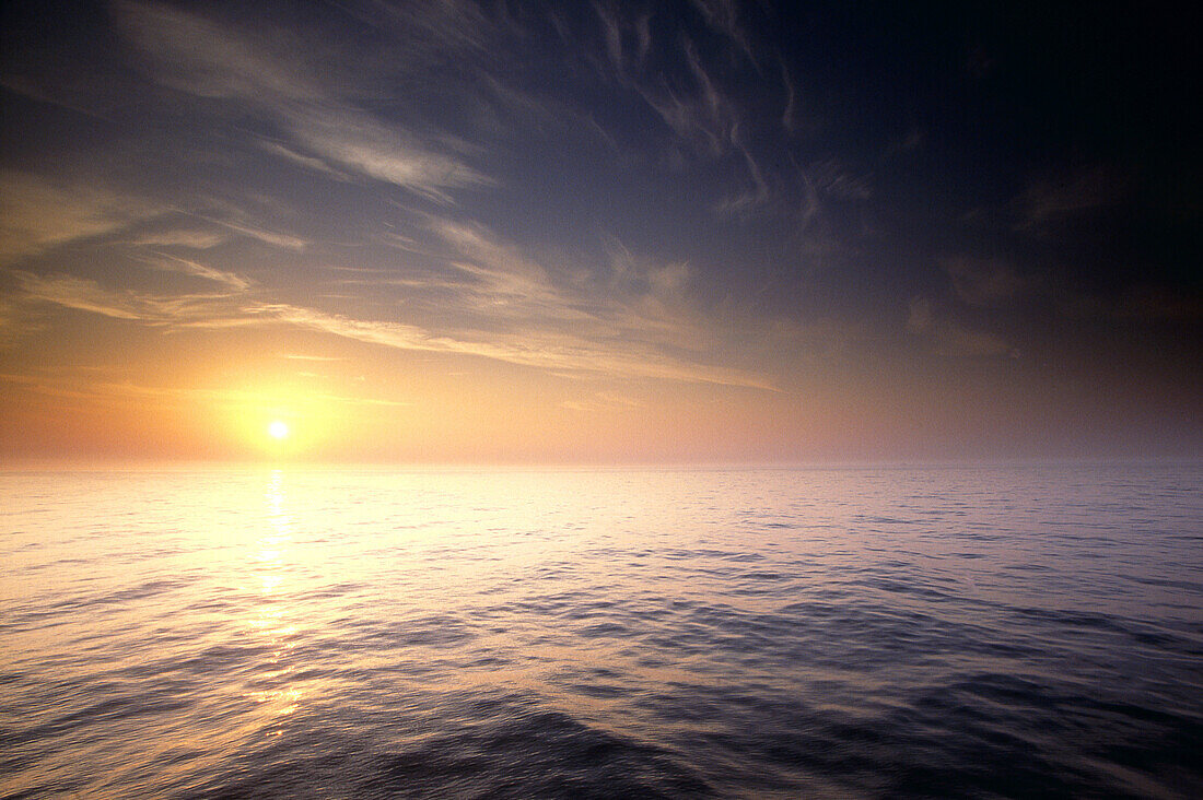 Misty dawn and calm sea off the coast of Aberdeen, North Sea, Scotland