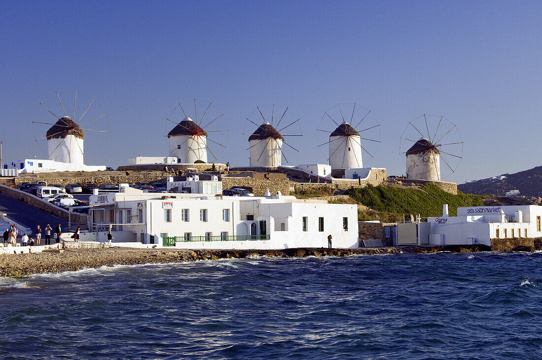 The windmills of Hora overlooking the Aegean Sea on the Greek Island of Mykonos, Greece.