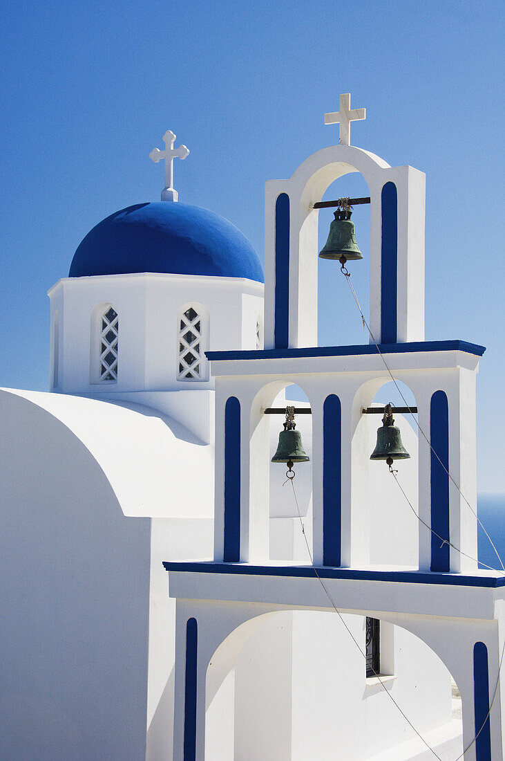 A traditional Greek blue domed church near Pyrgos on the Greek Island of Santorini, Greece.