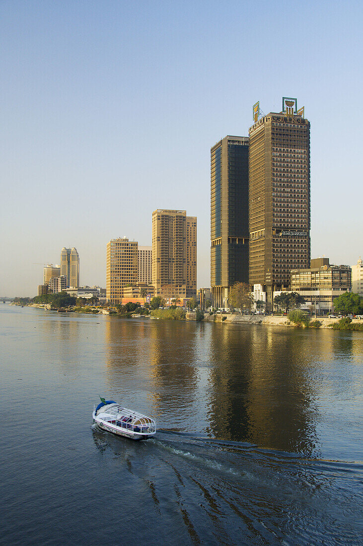 A Nile River taxi and the city skyline of Cairo, Egypt