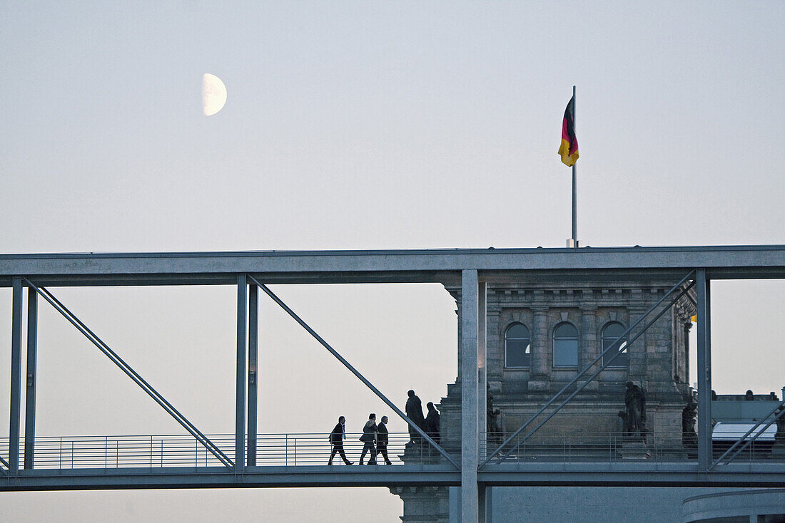 Pedestrian bridge over river Spree, Reichstag building in background, Berlin, Germany