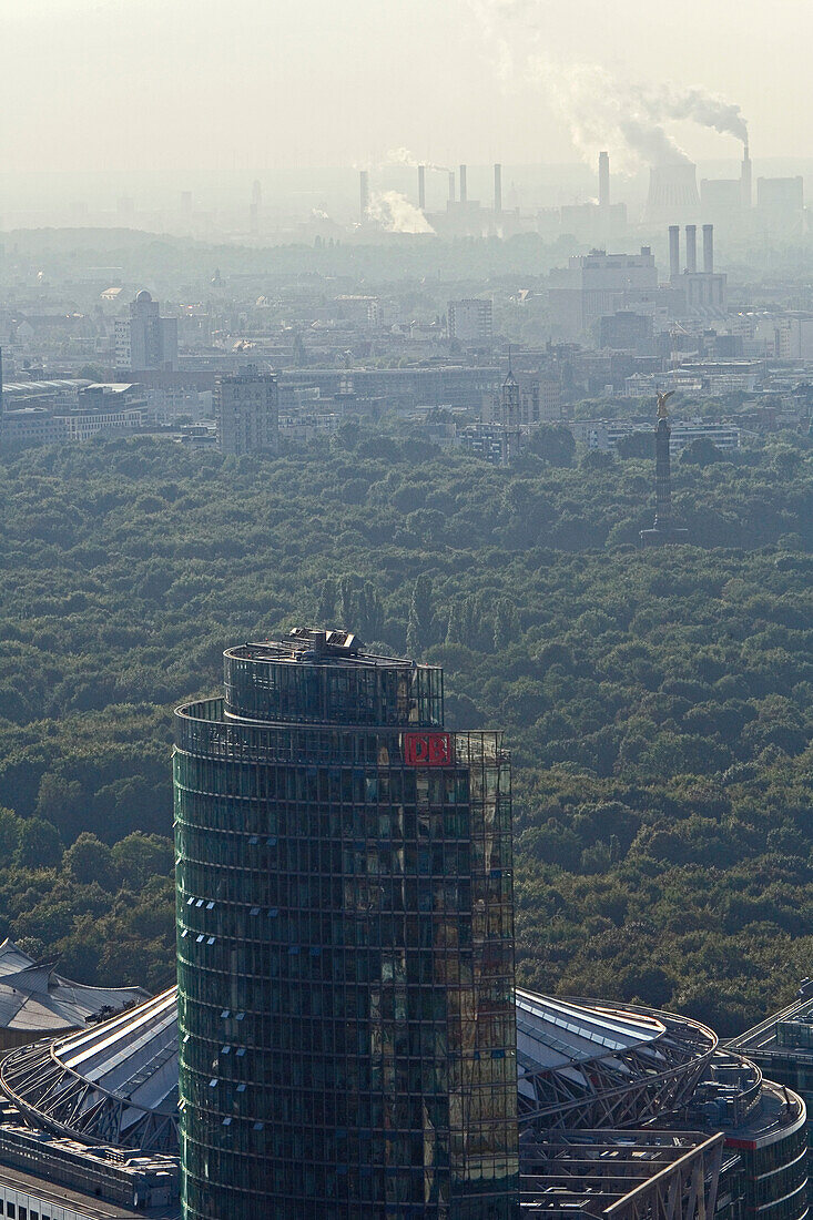 View at DB Tower and smoking chimney stacks, Berlin, Germany, Europe