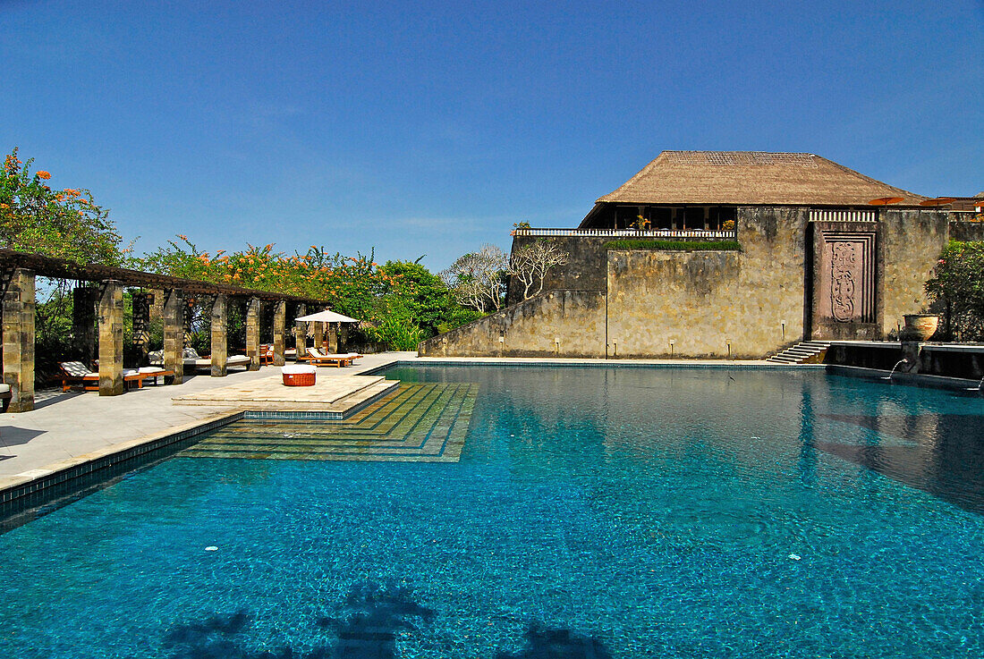 Deserted pool at Amanusa Resort under blue sky, Nusa Dua, Southern Bali, Indonesia, Asia