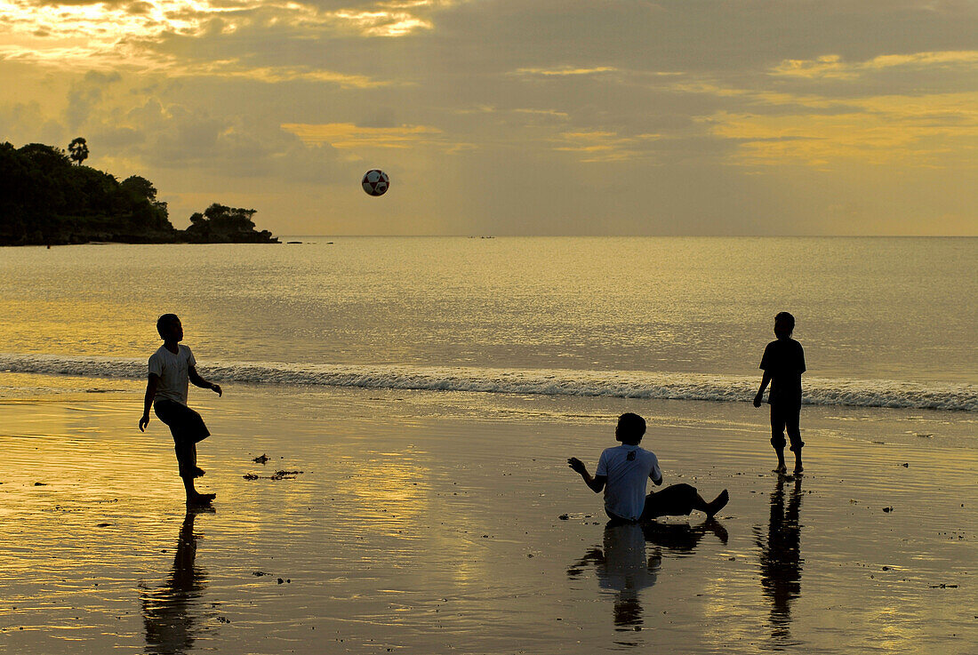Children playing at the beach in the evening, Jimbaran, Bali, Indonesia, Asia