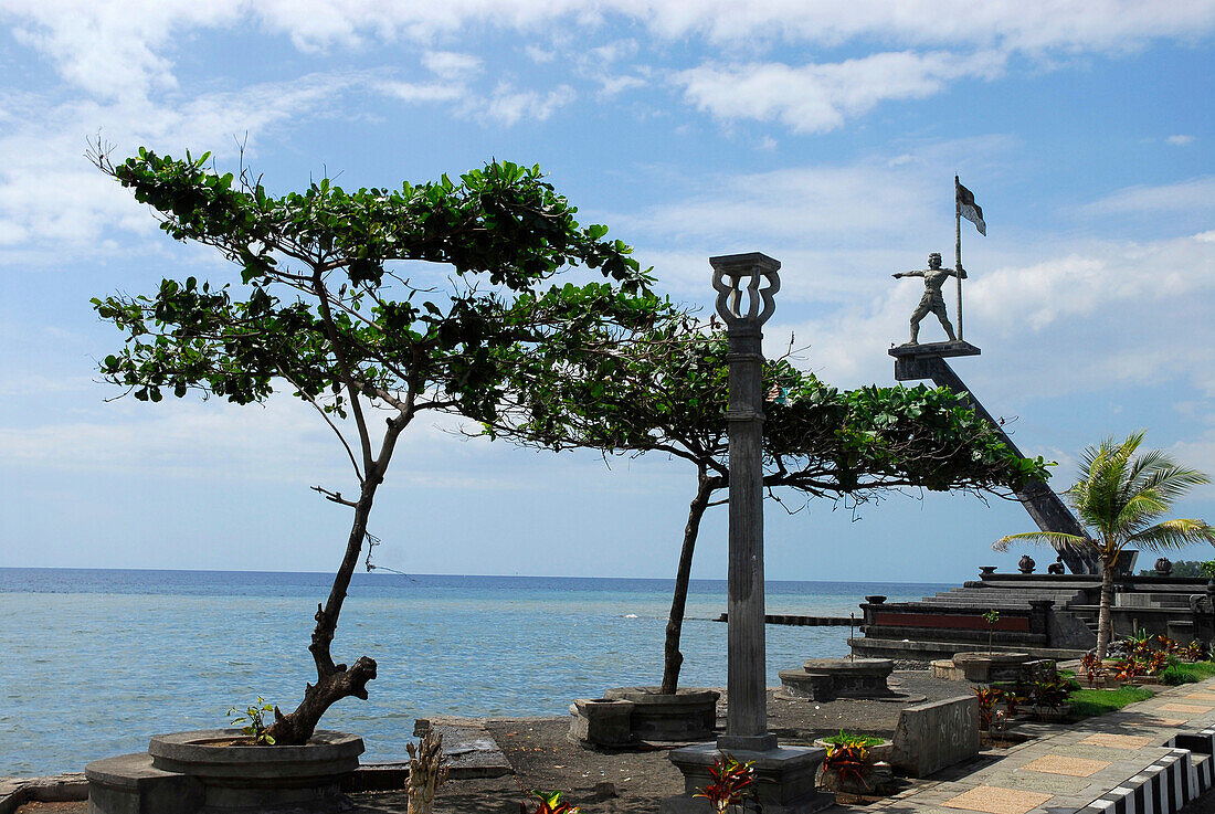 Old harbour with monument under cloudy sky, Singaraja, North Bali, Indonesia, Asia