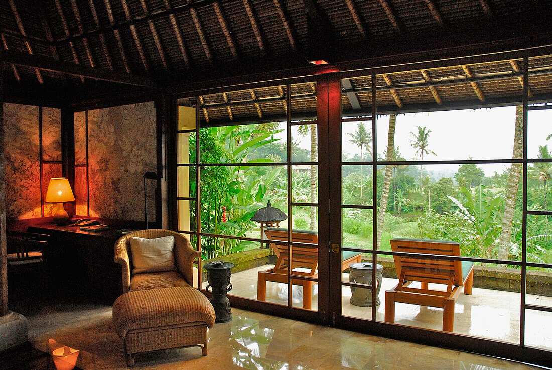 Interior view of a bungalow of the Amandari Resort with view at the terrace, Yeh Agung valley, Bali, Indonesia, Asia