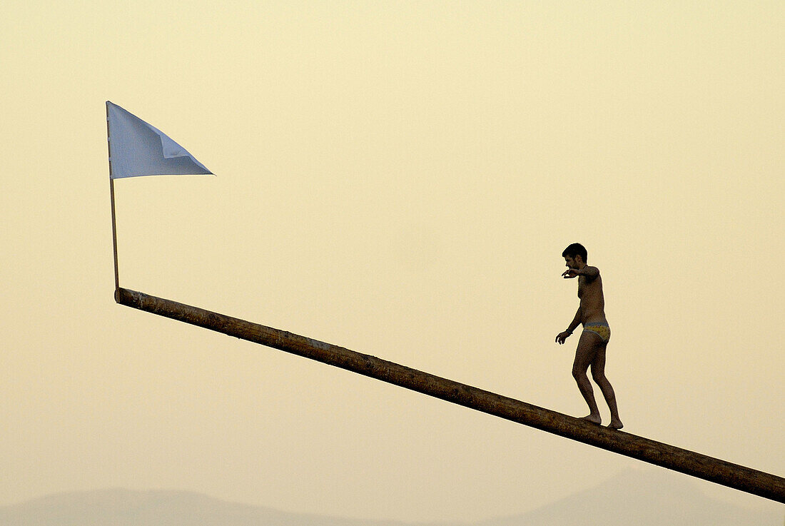 Man trying to reach the flag as a target.