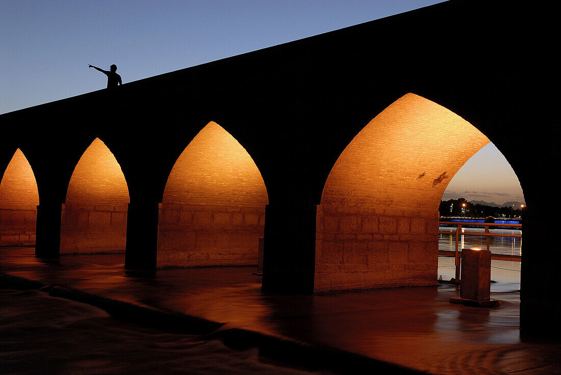 Man pointing in the direction of Mecca. Esfahan. Iran