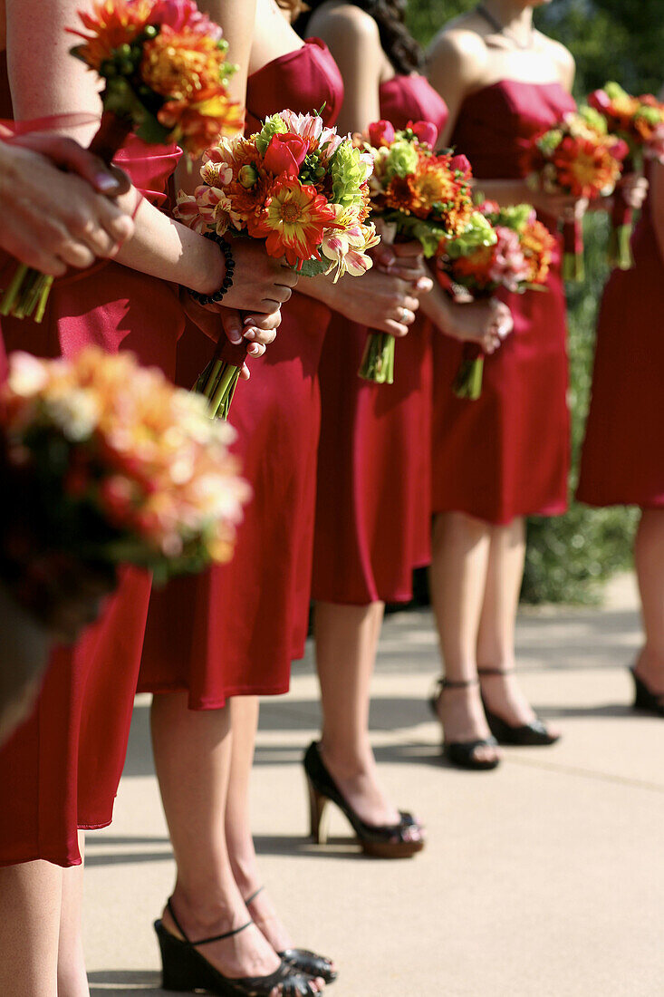 Bouquet, Bouquets, Bridesmaid, Bridesmaids, Color, Colour, Contemporary, Daytime, Evening gown, Evening gowns, Exterior, Female, Headless, Human, Many, Marriage, Matrimony, Outdoor, Outdoors, Outside, People, Person, Persons, Red, Wedding, Weddings, Woman