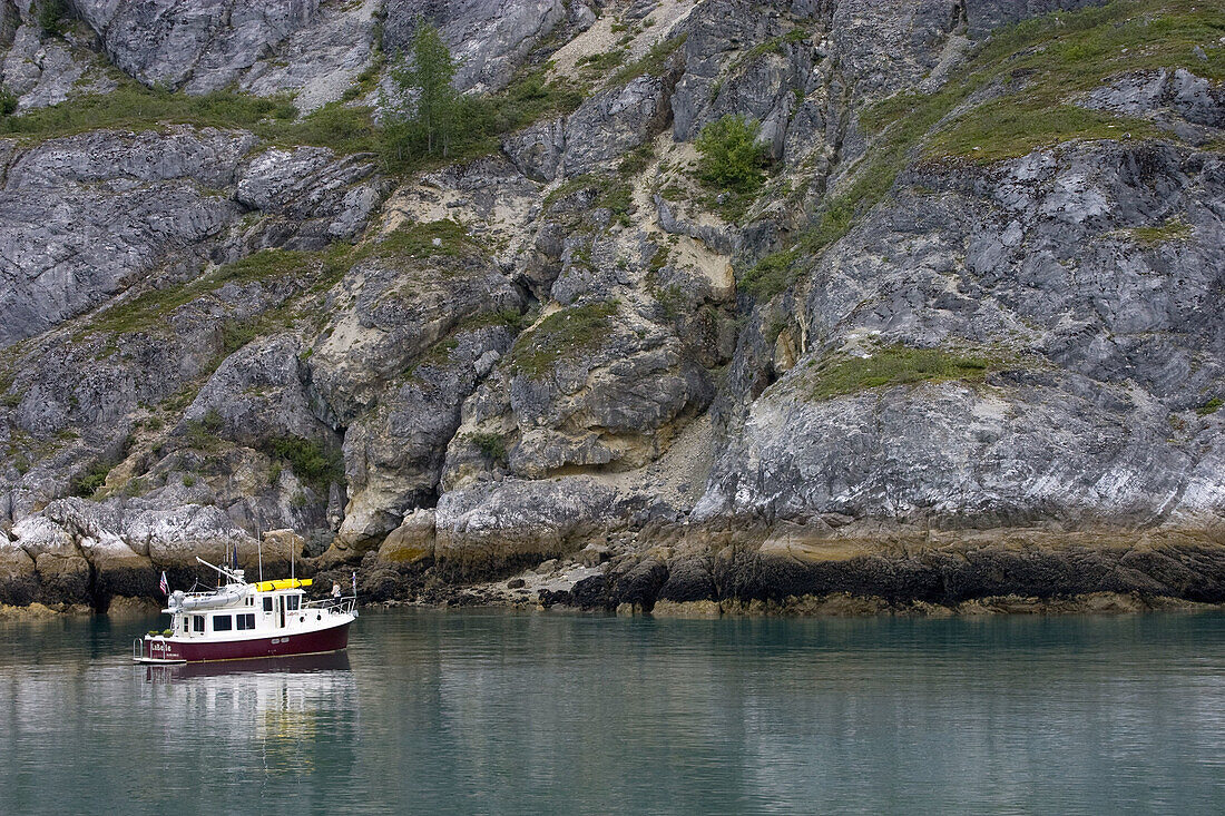 Fishing boat anchors in the picturesque setting of Icy Strait in Alaska, USA