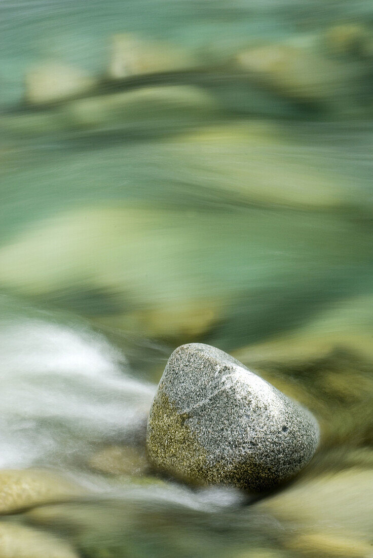 Rock in turquise waters of Bacon Creek, North Cascades, Washington, USA
