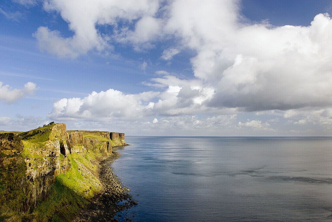 Dunite cliffs on the coast of Isle of Skye Scotland, Kilt Rock is in the distance.