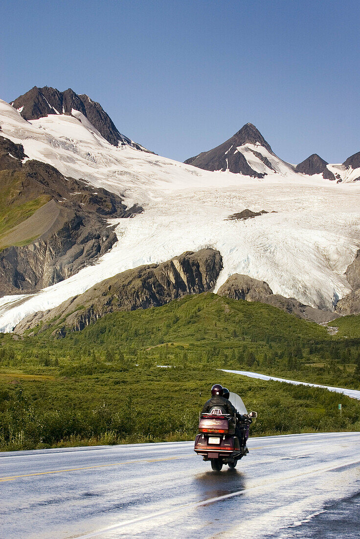 Richardson Highway winding its way up to Thompson Pass. In the background is the Worthington Glacier. Alaska, USA