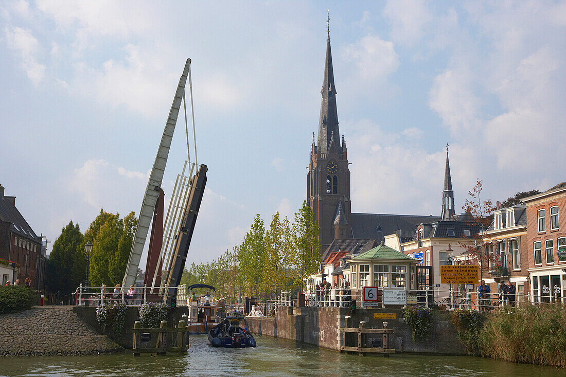 A boat driving past a bascule bridge on the river Smal Weesp at Weesp, Netherlands, Europe