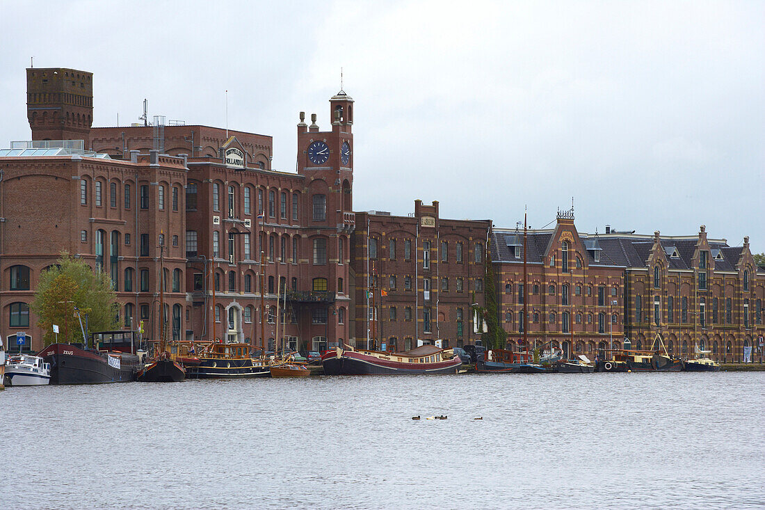 Brick-lined buildings along the river Zaan at Wormerveer, Netherlands, Europe