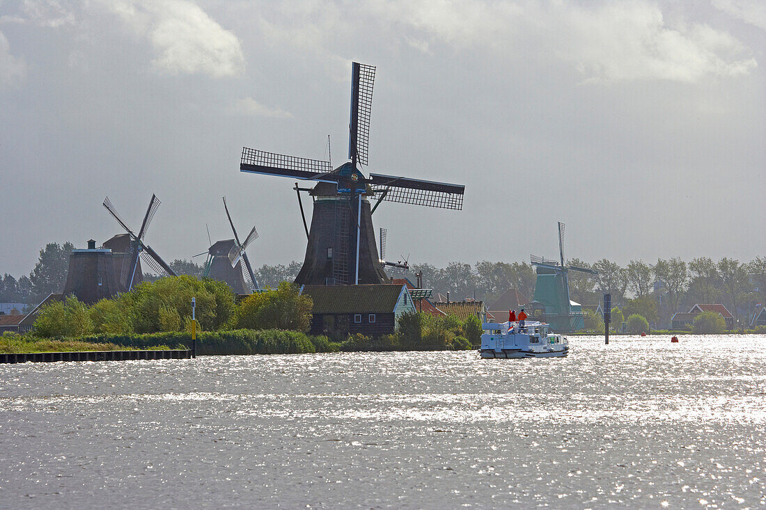 View at windmills at open-air museum Zaanseschans at the river Zaan, Netherlands, Europe