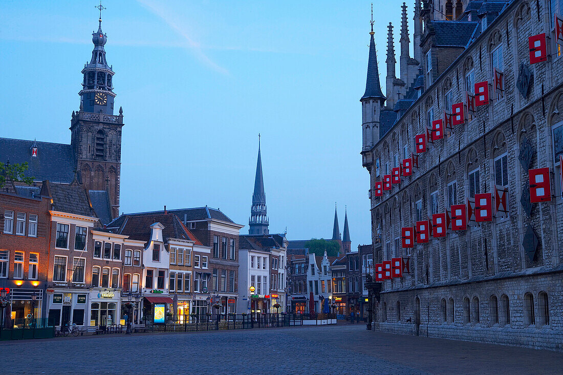 Market place with gothic town hall and church in the evening, Old Town, Gouda, Netherlands, Europe