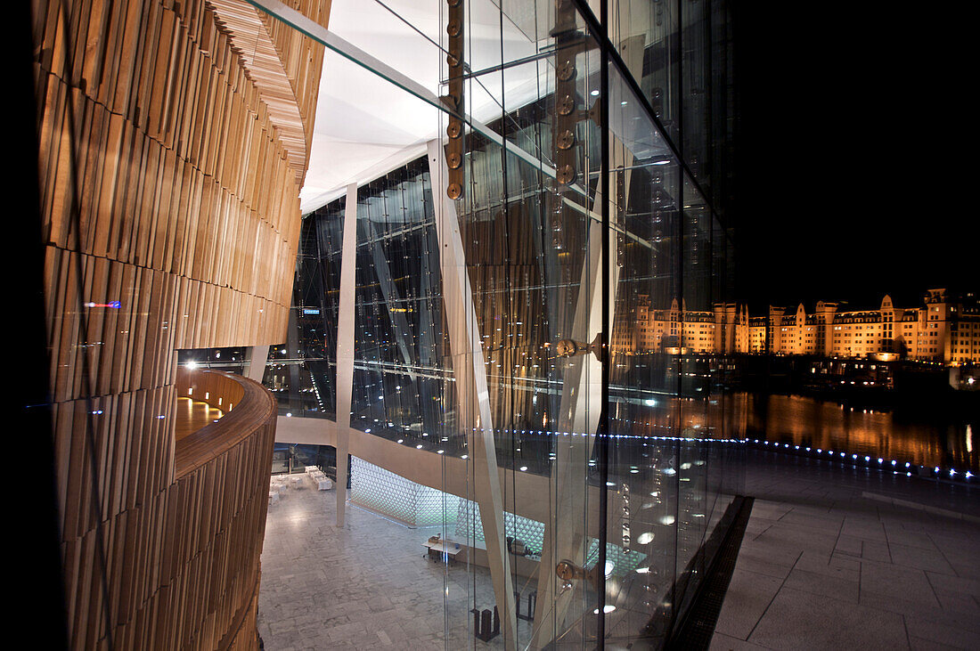 Detail of the opera house and view at the city at night, Oslo,  Norway