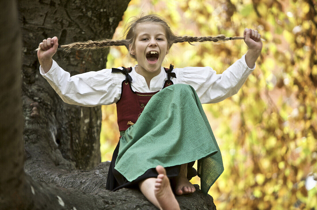 Girl wearing a dirndl, screaming, Kaufbeuren, Bavaria, Germany