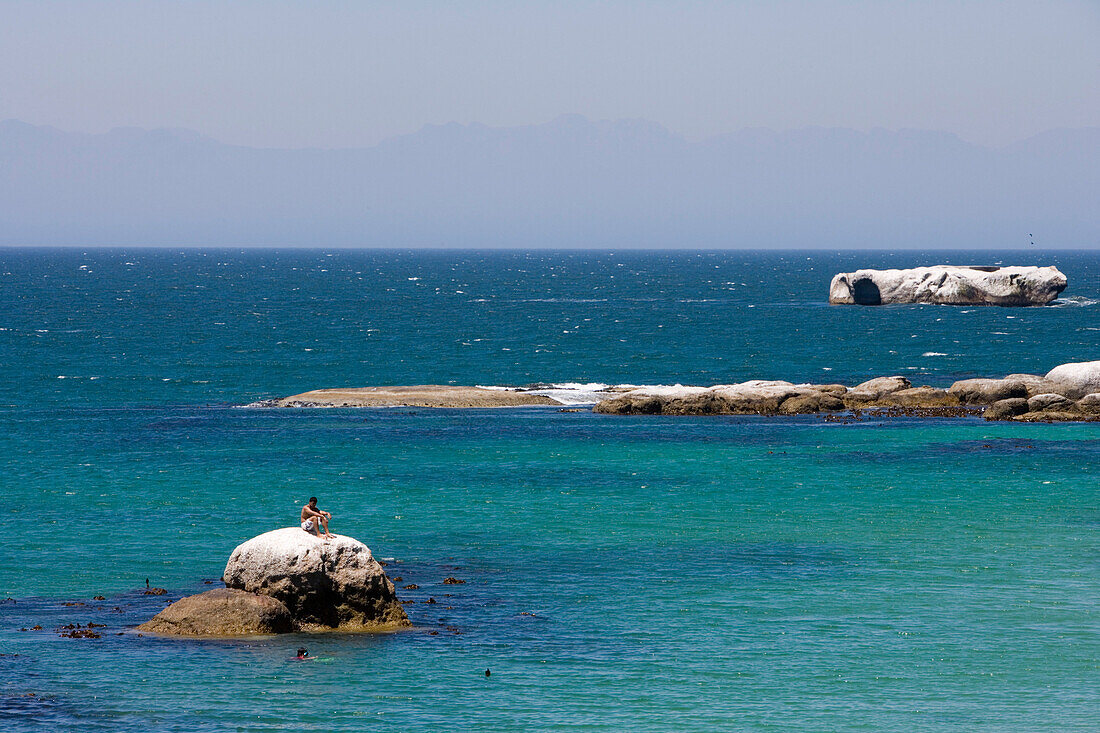 Man relaxing on a rock, Simon's Town, near Cape Town, Western Cape, South Africa, Africa