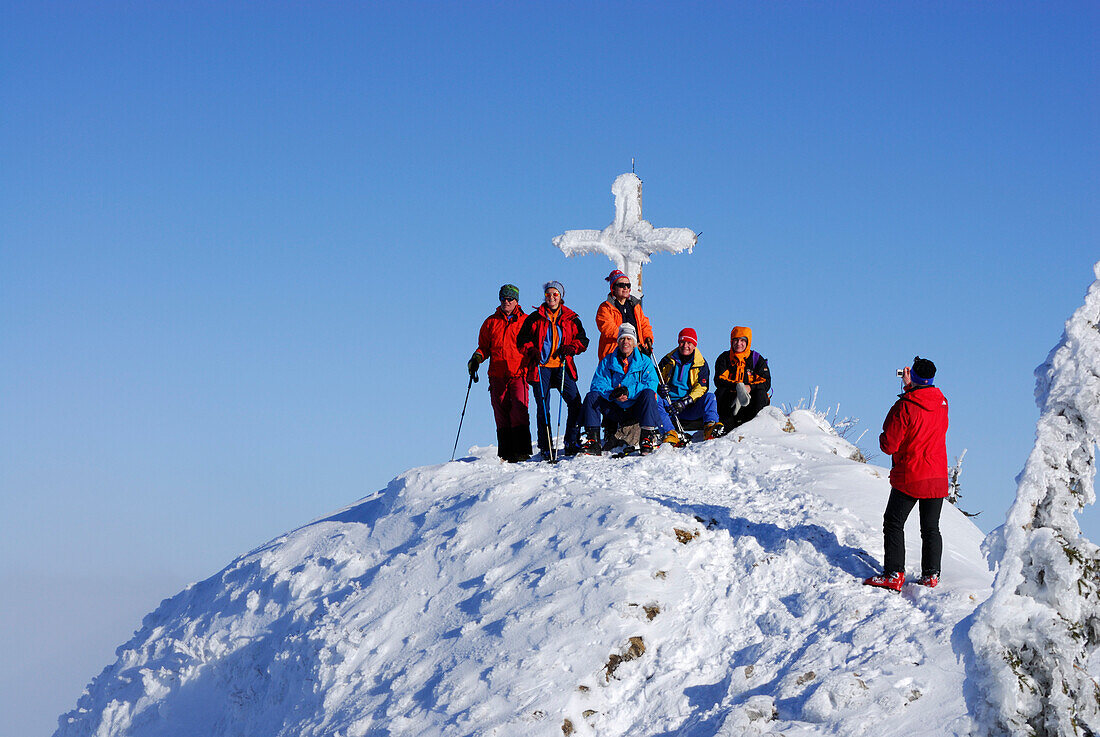 Alpinists photographing on summit of Rauhkopf, Bavarian foothills, Upper Bavaria, Bavaria, Germany