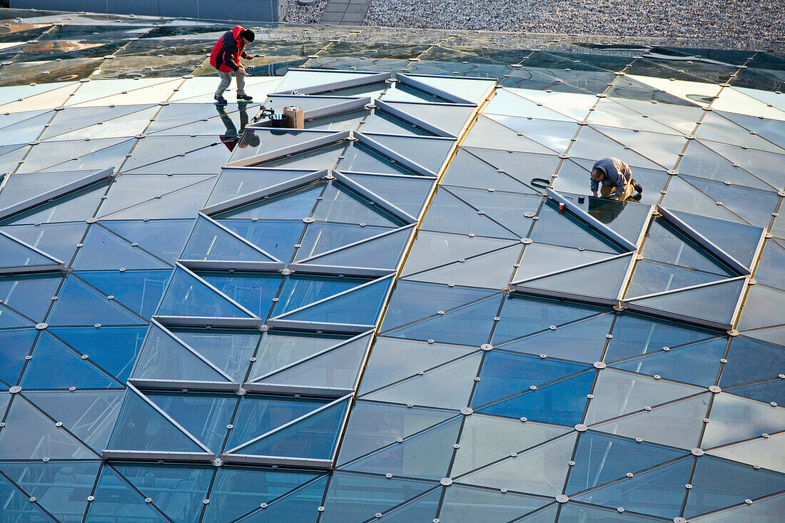 repairing glass roof, Potsdam Platz, Berlin Germany