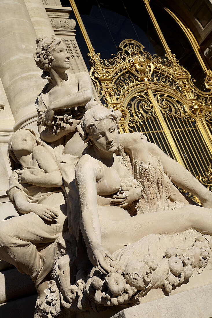 Stone statues decorating the entrance of Petit Palais. Paris. France