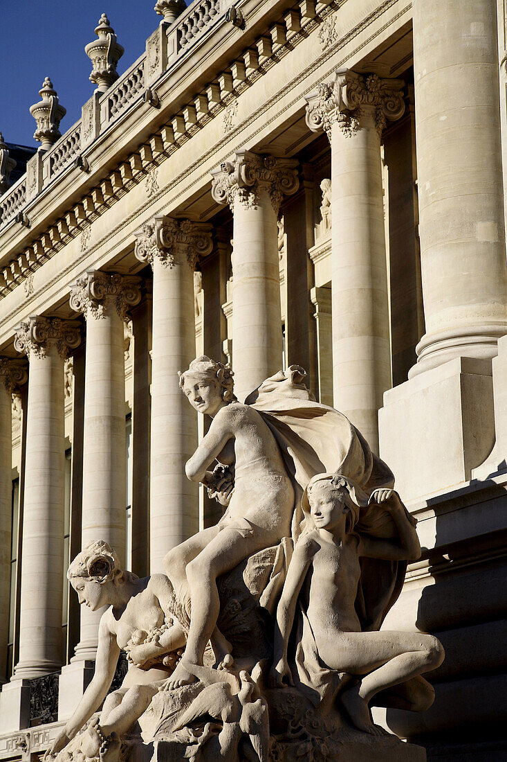 Stone statues decorating the entrance of Petit Palais. Paris. France