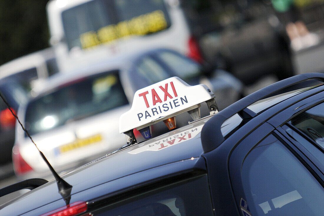 TAXI sign on top of a parisian taxi. Paris. France