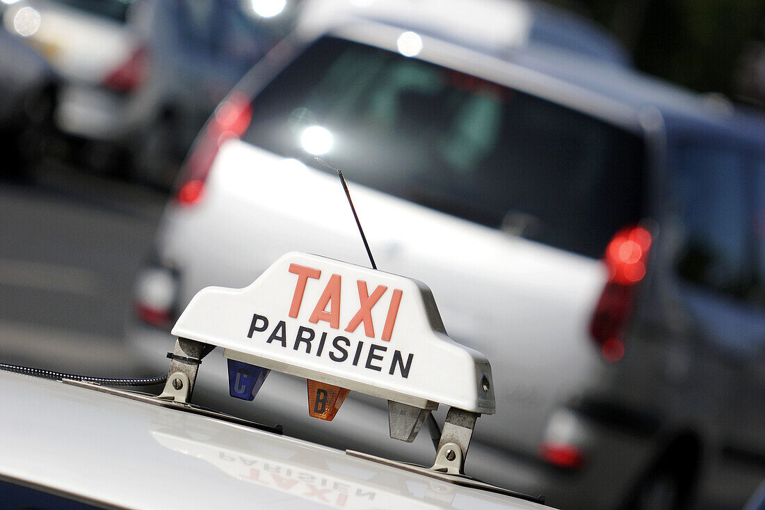 TAXI sign on top of a parisian taxi. Paris. France