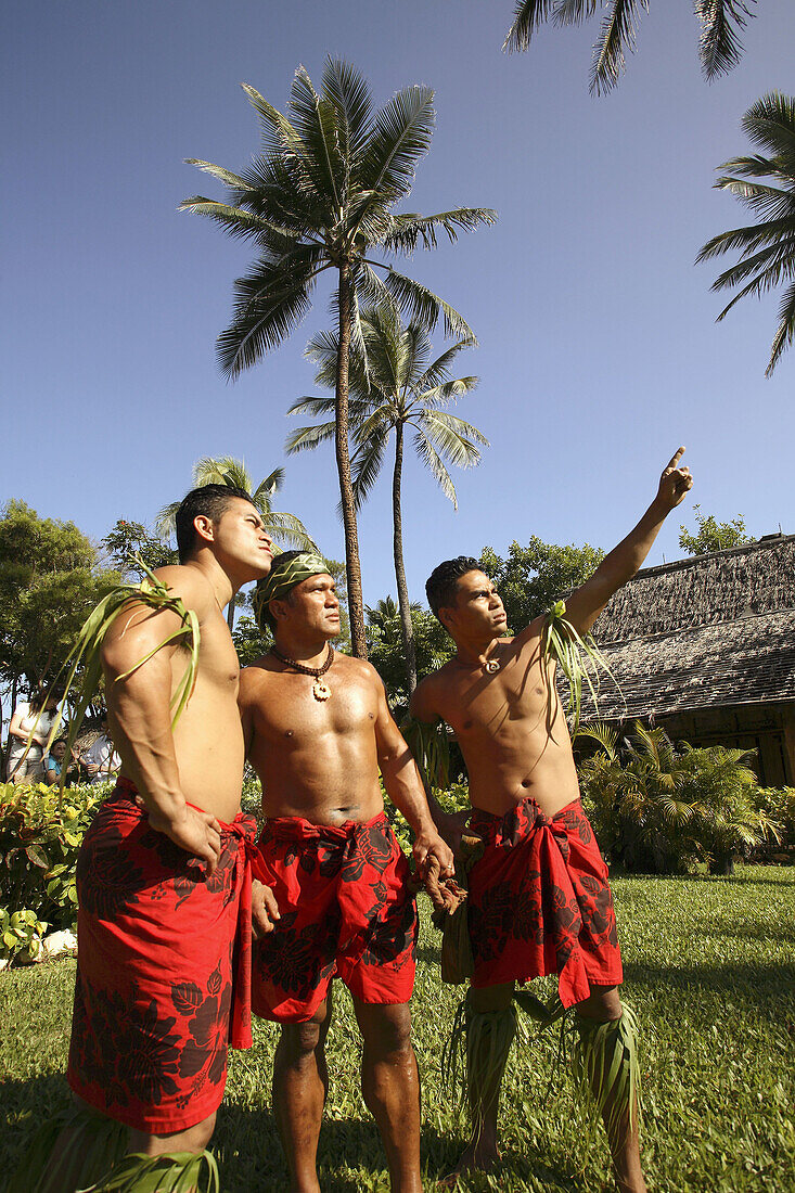 Three Hawaiian native men in Polynesian Cultural Center. Oahu. Hawaii. USA