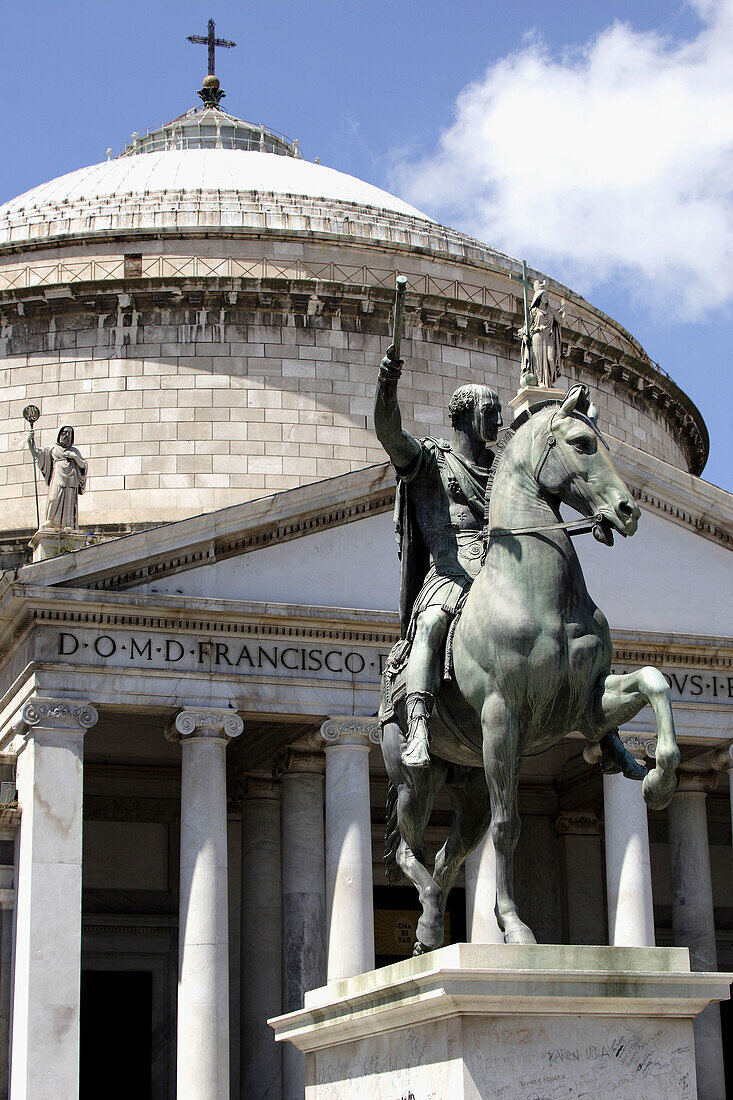The equestrian bronze statue of Charles III of Borbone in front of Church of San Francesco di Paola on the Piazza del Plebiscito. Naples. Campania. Italy