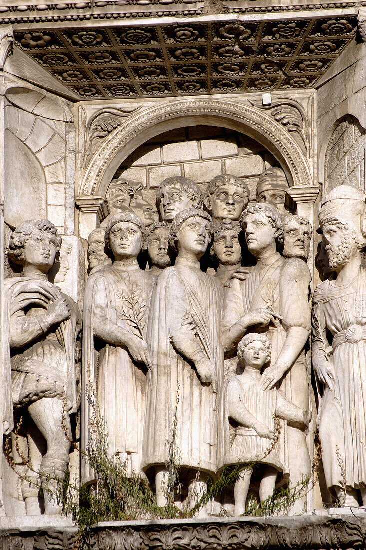 A closed up view of stone carved figures on triumphal arch entrance of Castel Nuovo. Naple. Campania. Italy