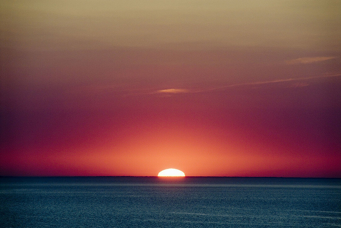 Sunset at 54 degrees north. Jutland Denmark. Orange sky and a deep blue sea.