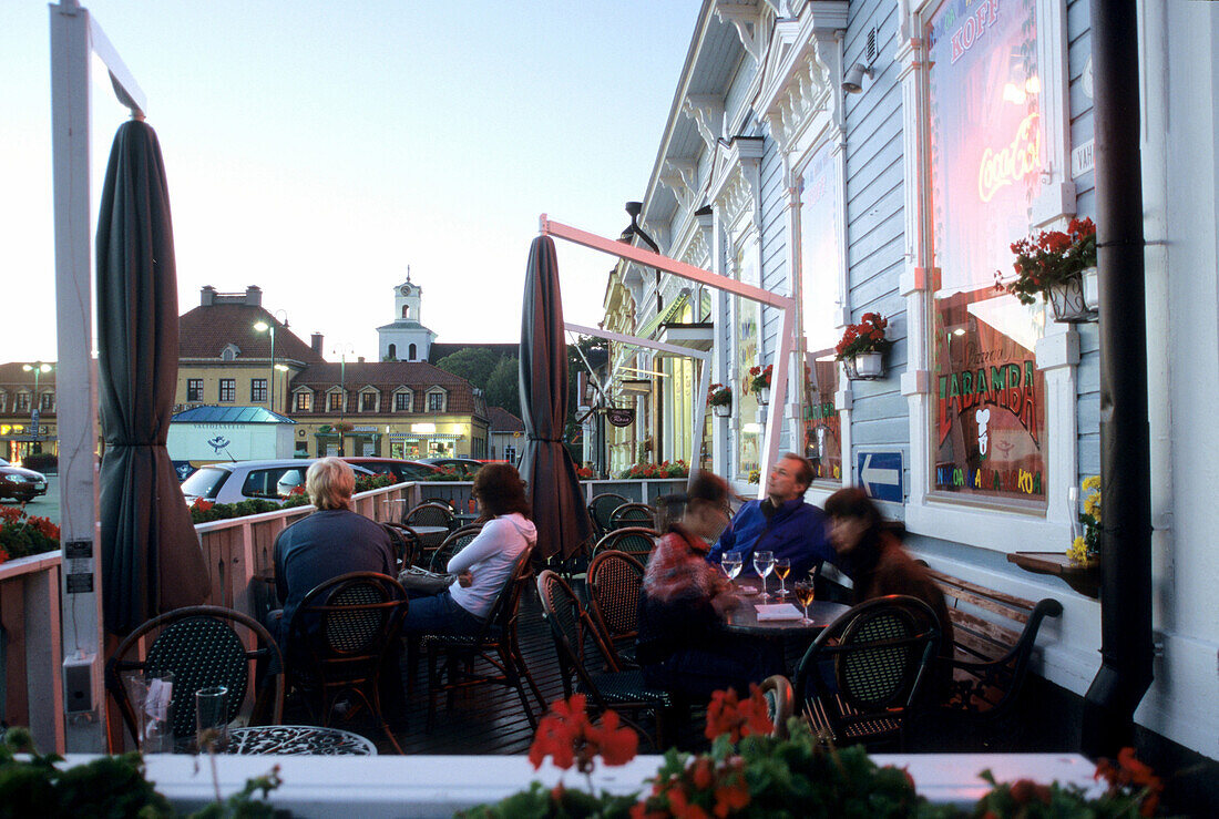 People sitting in a cafe at the marketplace in the evening, Rauma, South Finland, Europe