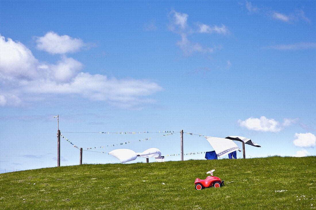 Toy car and clotheslines, Hooge hallig, North Frisian Islands, Schleswig-Holstein, Germany