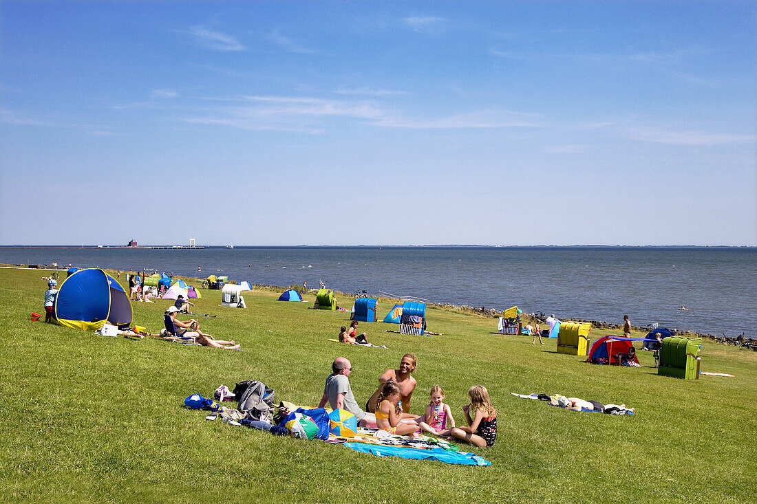 People on dyke, Pellworm Island, North Frisian Islands, Schleswig-Holstein, Germany