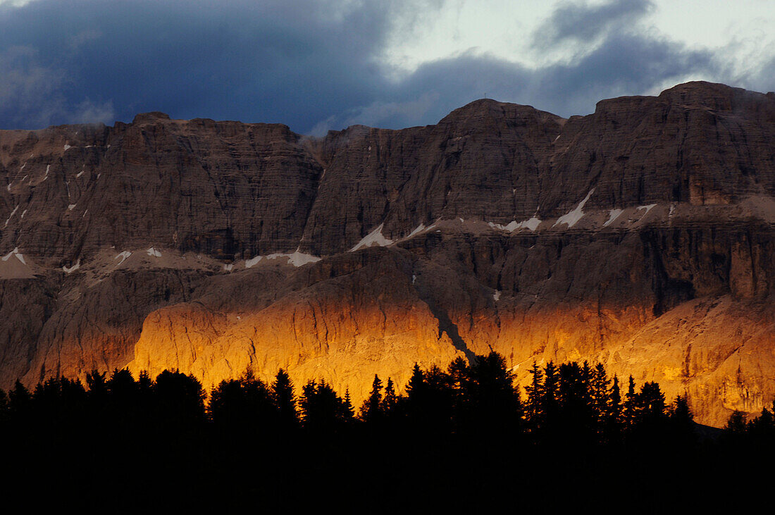 Mountain scenery at sunset under clouded sky, Dolomites, South Tyrol, Italy, Europe