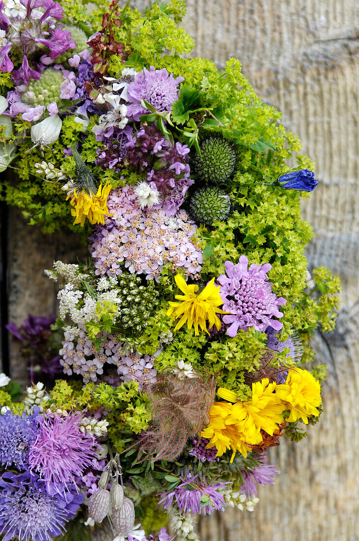 Floral wreath made of meadow flowers, South Tyrol, Italy, Europe