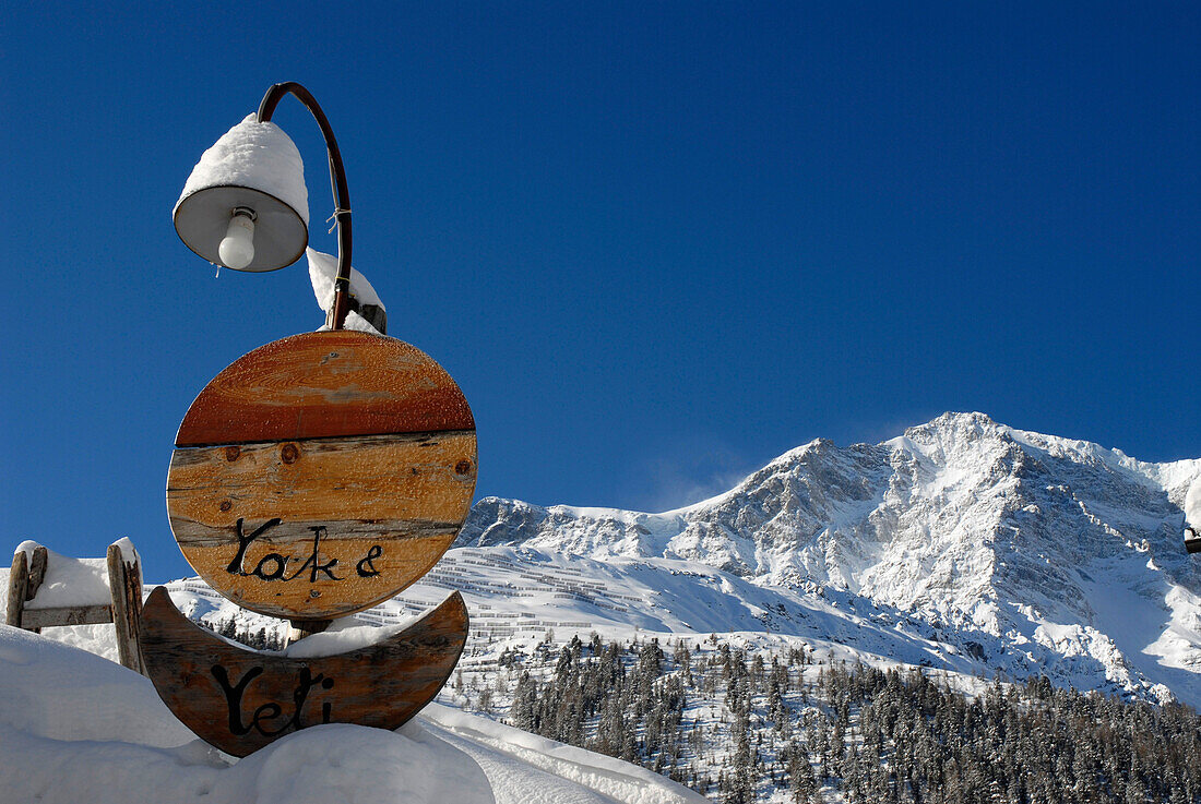 The sign of the guesthouse Yak & Yeti in the snow, Sulden, Val Venosta, South Tyrol, Italy, Europe