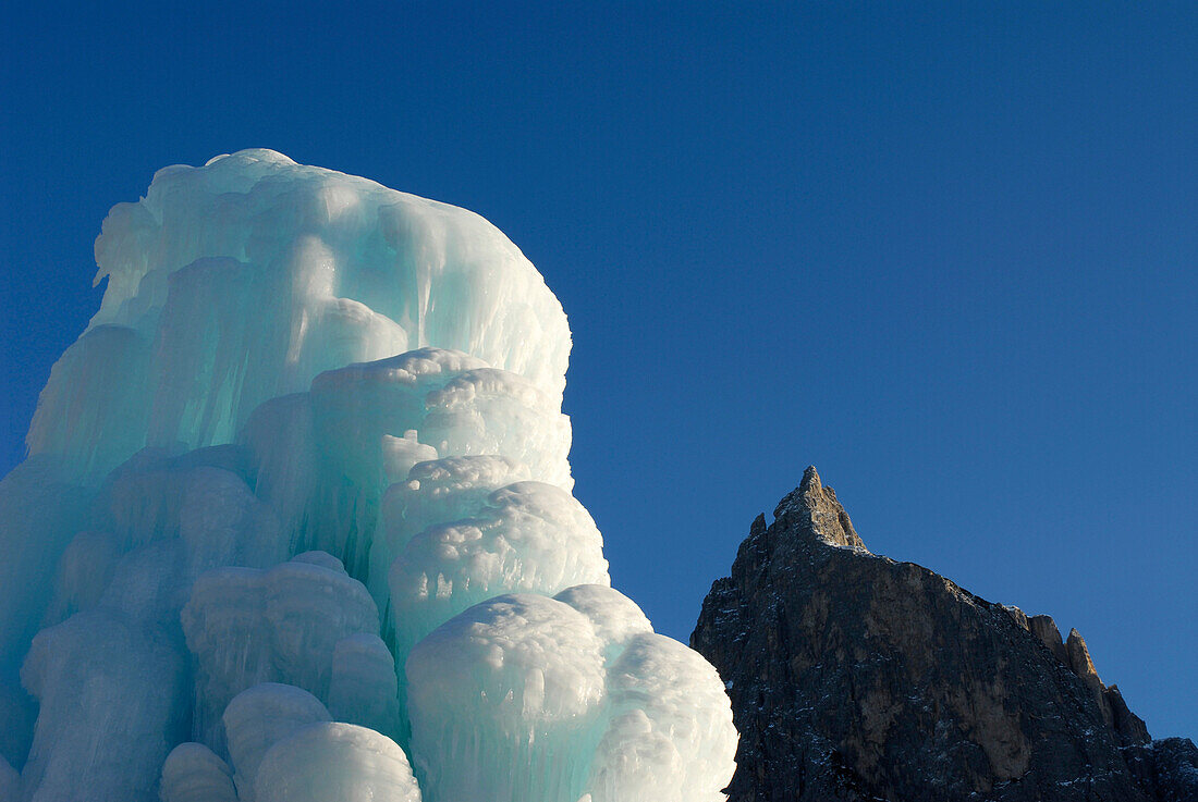 Ice sculpture and mountain summit, Santnerspitze, Schlern, Dolomites, South Tyrol, Italy