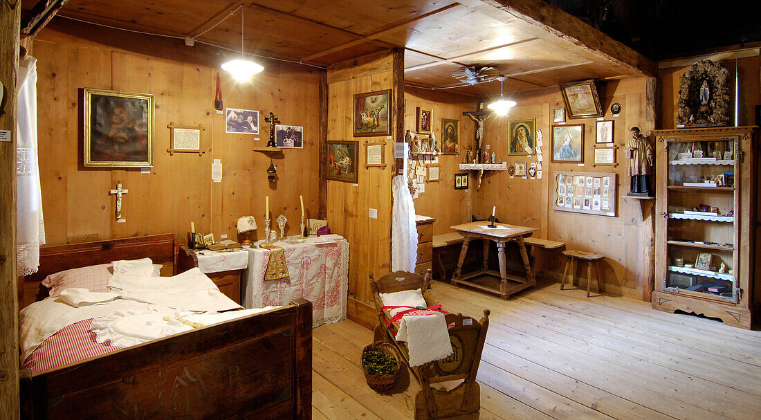 Bedroom and living room with wooden furniture, Exhibition in the Local history museum in Tschoetscherhof, St. Oswald, Kastelruth, Castelrotto, South Tyrol, Italy