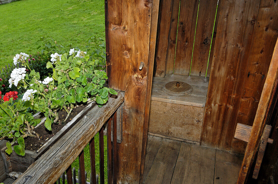 Outdoor toilet on the balcony, Farmhouse in the South Tyrolean local history museum at Dietenheim, Puster Valley, South Tyrol, Italy