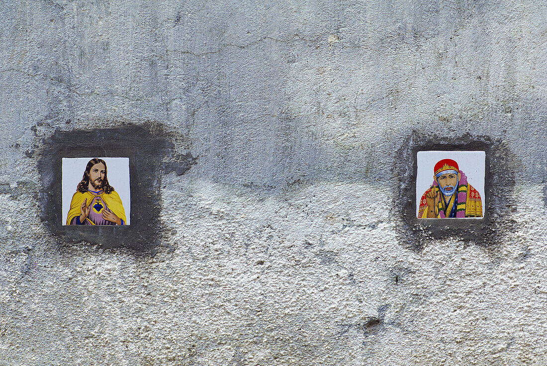 Tiles with images of Jesus Christ and Shirdi Sai Baba on the external wall of a residential condominium in Santacruz district, Mumbai, Maharashtra, India