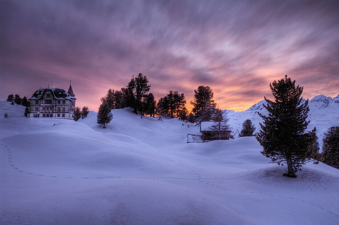 Winter view of Villa Cassel at sunset. Riederalp municipality, Raron district, Valais, Switzerland
