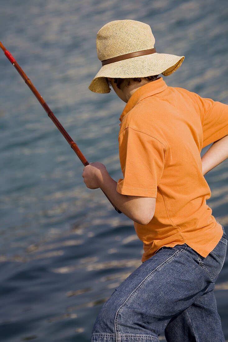 Boy fishing, Antibes. Provence-Alpes-Côte d'Azur, France
