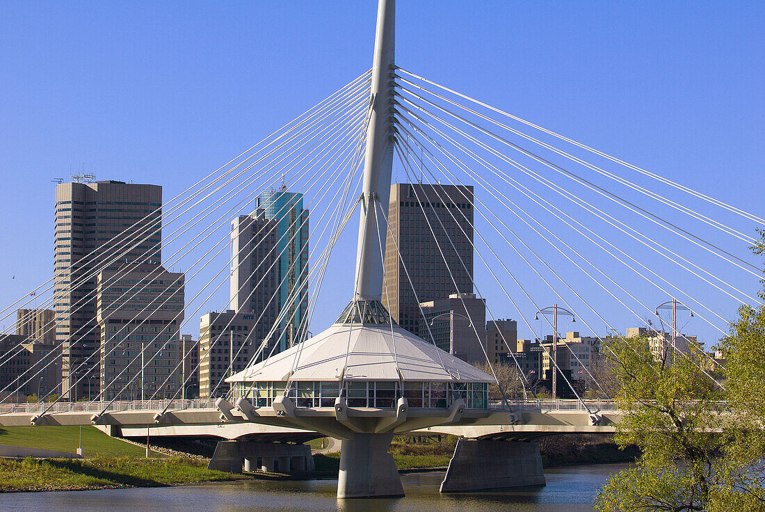 The Esplanade Riel bridge (with the Red River in foreground and Downtown Winnipeg in background), Winnipeg, Manitoba, Canada