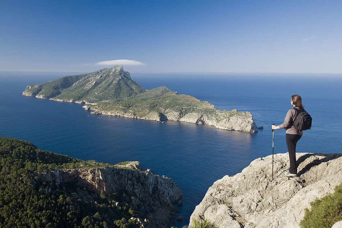 Female walker looking at Sa Dragonera island from Majorca, Spain