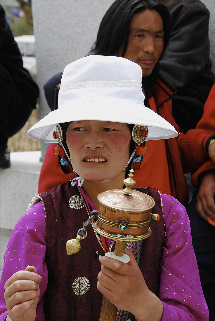 Tibetan pilgrim going round the Potala to end the pilgrimage. Lhasa. Tibet. China.