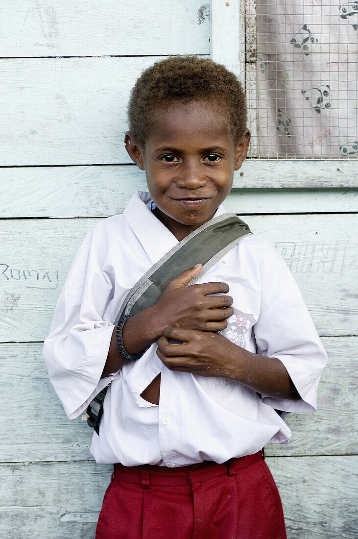 Smiling boy in school uniform, Indonesia